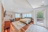 Retreat to the primary suite - wood floors, 2 walk in closets