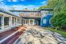 Courtyard patio with access from Dining Area and Family Room, mahogany decking and stone patio
