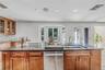 lagre center island with sink and ceramic cooktop