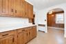 Spacious Eat-In KitchenThis bright and spacious eat-in kitchen offers a warm and inviting setting for everyday living. Featuring abundant natural wood