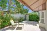 Double-doors lead to a private patio retreat.