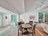 Dining area flows seamlessly from the living area and wet bar.