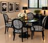 Built-in window blinds, permanent wall art, glossy tile flooring, and a glass-top table