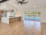 Living area with kitchen and pool access
