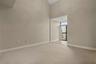 The 2nd bedroom includes its own sunroom with a Juliette balcony and vaulted ceilings to add to the openness. To make maximum use of the vaulted ceili