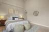 Vaulted ceilings continue to the primary suite in an expansive layout.