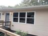 Newer windows, siding, outdoor outlets and front door.