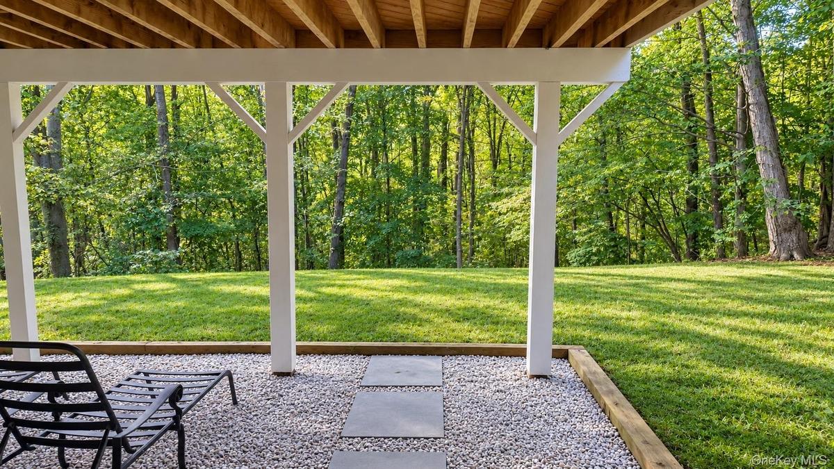 Private, Nearly Level Backyard Framed by Mature Landscaping—With Endless Possibilities! (Digitally Enhanced Photo)