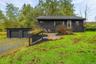 2 car garage, steps to gravel/bluestone entrance, cozy courtyard