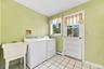 Laundry room leads out to backyard