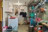 Laundry/storage room in unfinished portion of basement offering plenty of additional flexible space.