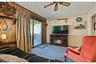 Third bedroom or versatile bonus room with direct access to the outdoor deck.