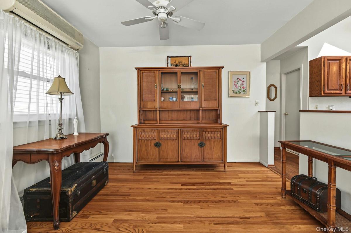 Formal dining room with hardwood floors and an easy flow into the kitchen and living room.