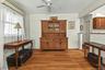 Formal dining room with hardwood floors and an easy flow into the kitchen and living room.