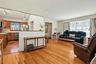 Formal dining room with hardwood floors and an easy flow into the kitchen and living room.