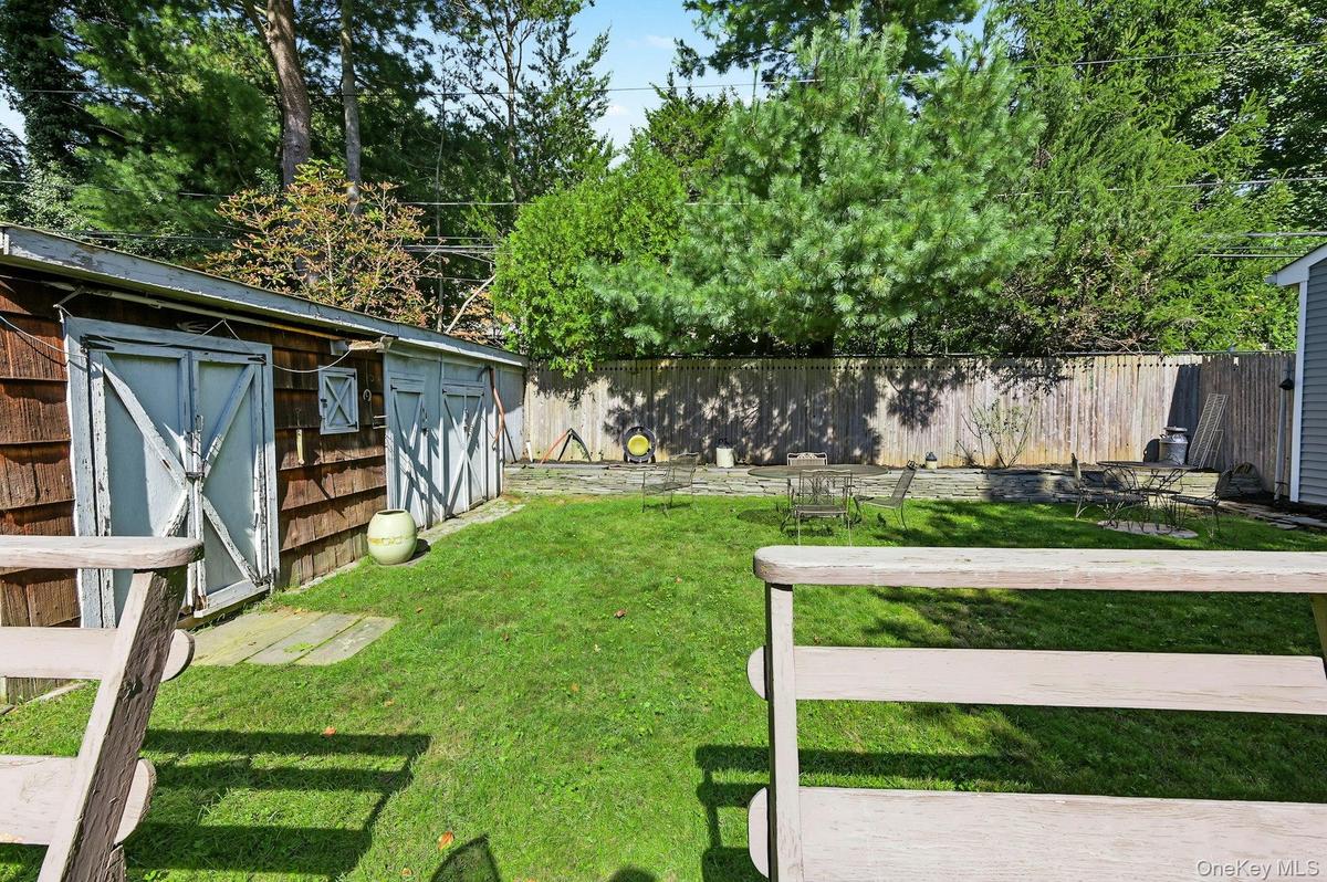 Private backyard with deck —perfect for relaxing or entertaining.