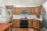 Bright eat-in kitchen with vaulted ceiling &  skylight