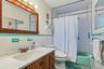 Full hall bathroom with tub/shower.