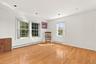 Gleaming hardwood floors can be found throughout the home. There is no lack of warmth or light.