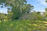 This lovely level yard is waiting for its next gardener!
