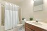 The hall full bath has a convenient linen closet - there's plenty of storage!