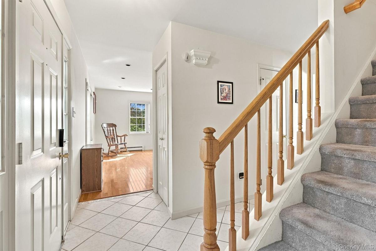 Take off your coat, there's a powder room here too. Let's check out the living room first.