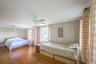 Hardwood flooring, two windows, two ceiling fans, and panel wall finishes