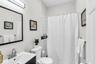 Guest bathroom with tub/shower combo