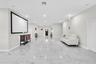 Spacious living area with 10-ft ceilings and recessed lighting
