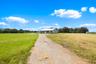 Long private driveway leading to the home