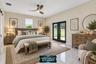 Primary suite with French doors to the porch (virtually staged)