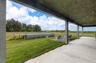 Covered porch with views across the property
