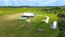 Aerial of the homesite with pool, guest unit and curved drive