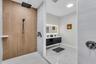Walk-in shower with wood-look accent tile