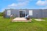 Container-style guest unit with private deck