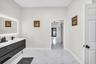 Primary bath with double vanity and lighted mirror