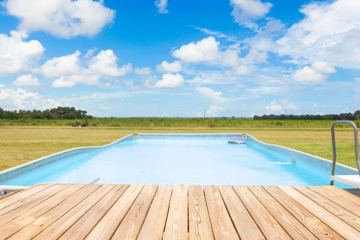 Above-ground pool with wood deck