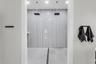 Oversized walk-in shower with dual rain showerheads