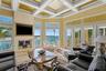 Great room with Coffered Ceilings, Fireplace and Water Views!