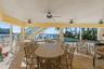 Large Covered Lanai has Hurricane Panels to protect outdoor furniture.