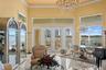 Formal Living Room with Marble Floors and French Doors to the Upper Level Lanai