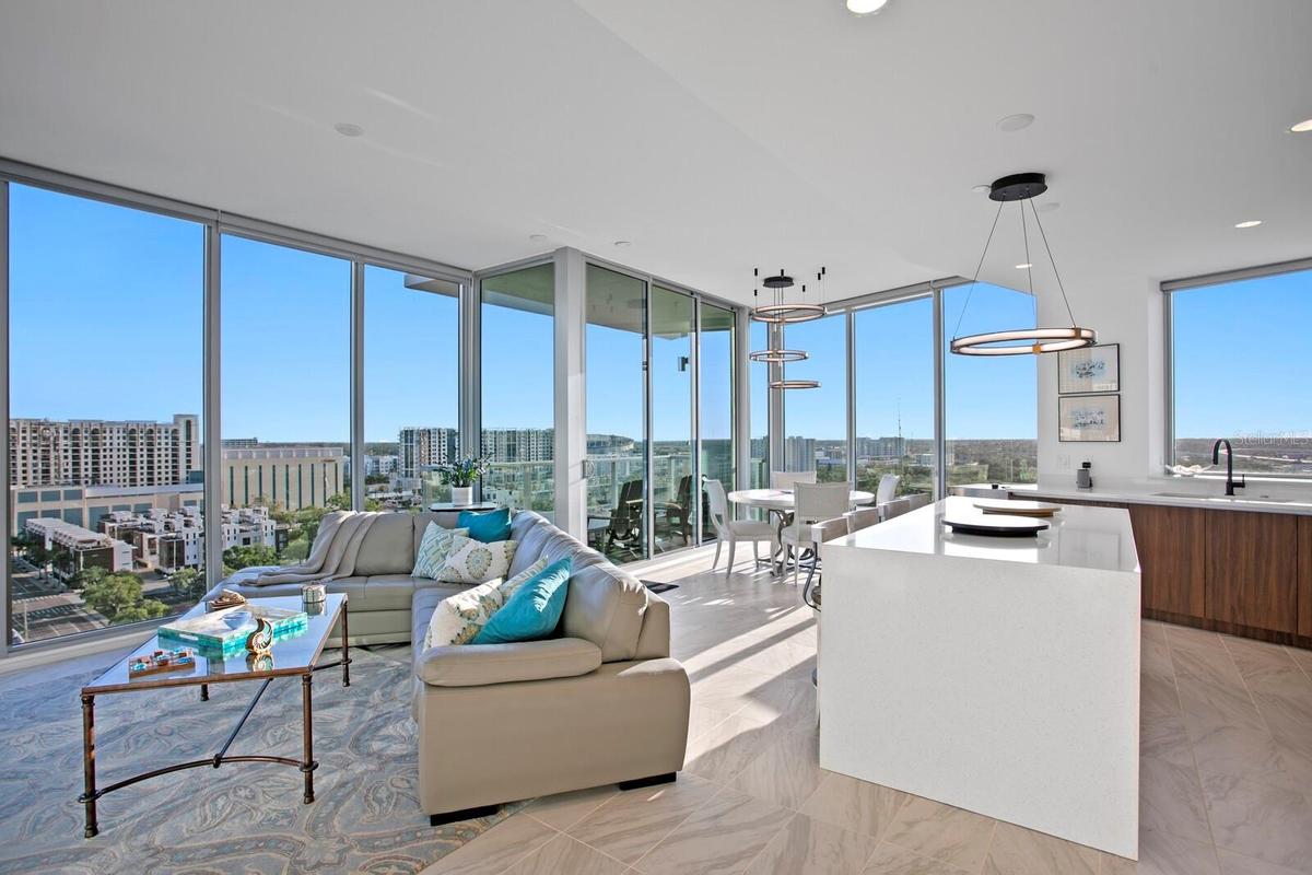Great Room Living and Dining Room and Kitchen with floor to ceiling windows.