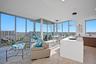 Great Room Living and Dining Room and Kitchen with floor to ceiling windows.