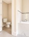 Separate water closet featuring a standard toilet