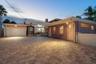 Currently used as a rental property, and consists on one main home of 3 bedrooms and 2 baths, oversized garage, living and family room areas.