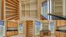 Oversized primary walk-in closet with morning kitchen
