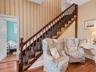 Hallway under stairs or seating area