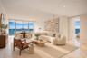 Floor-to-ceiling glass walls, stone flooring, and recessed ceiling lighting