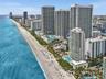 Experience luxury oceanfront living at Apogee Beach, featuring direct beach access, resort-style pools, and amenities, and exceptional coastal lifesty
