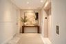 Foyer featuring stone tile flooring, recessed ceiling lighting, and a dedicated elevator access point